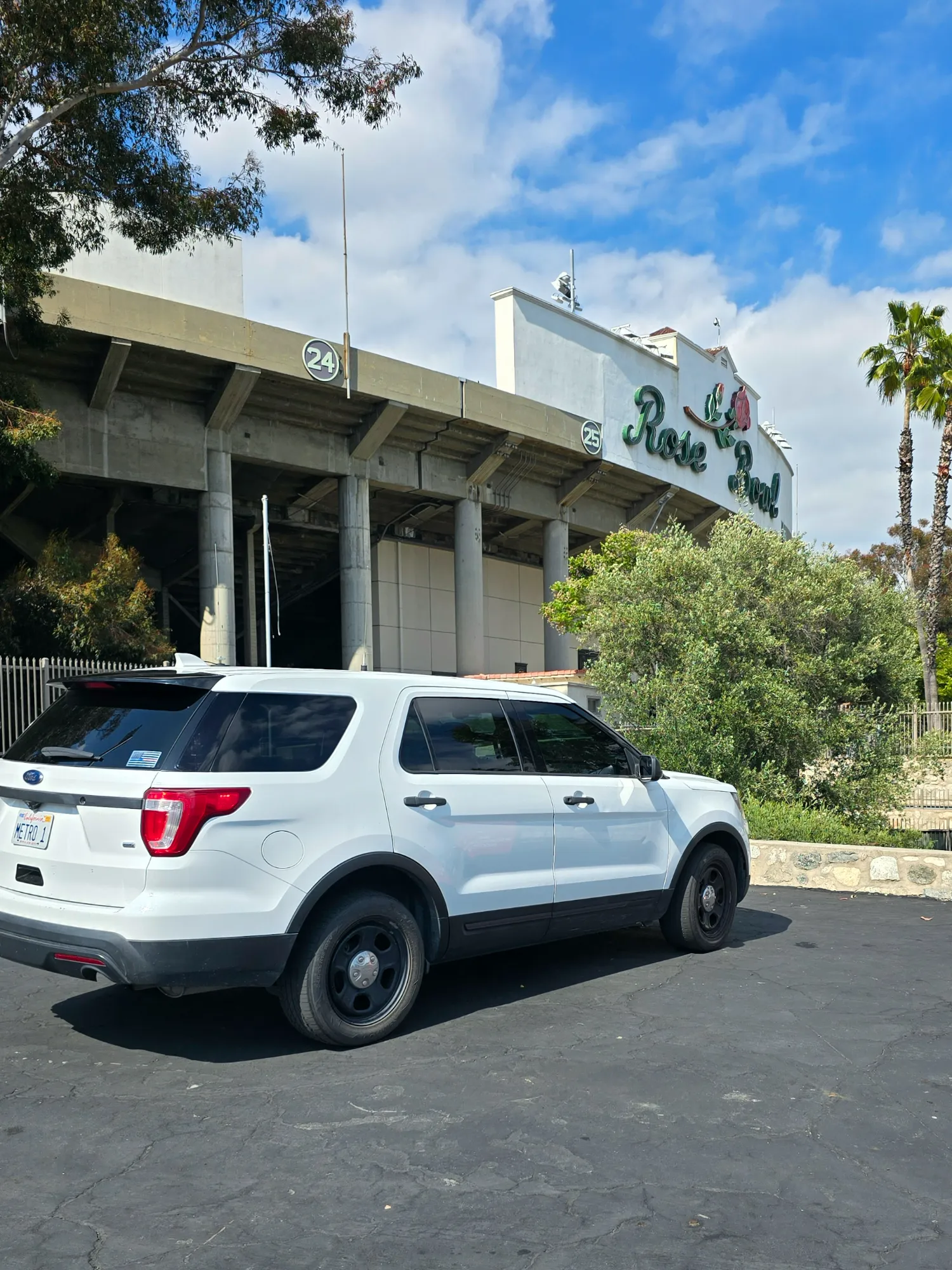 A FIREEMS SUV vehicle parked in front of the Rose Bowl.